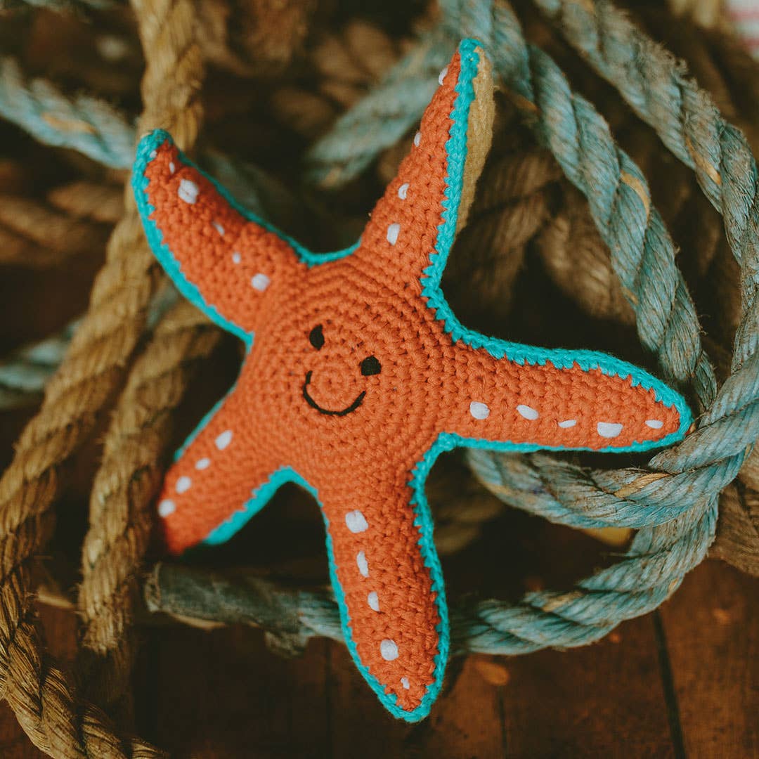 Starfish soft plush toy with squeaker, bright star-shaped sea creature design, sold by stitch + tail